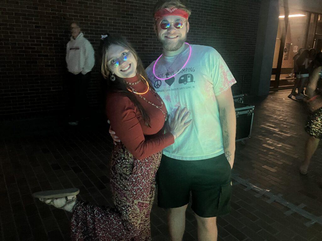 A couple joyfully posing for the picture