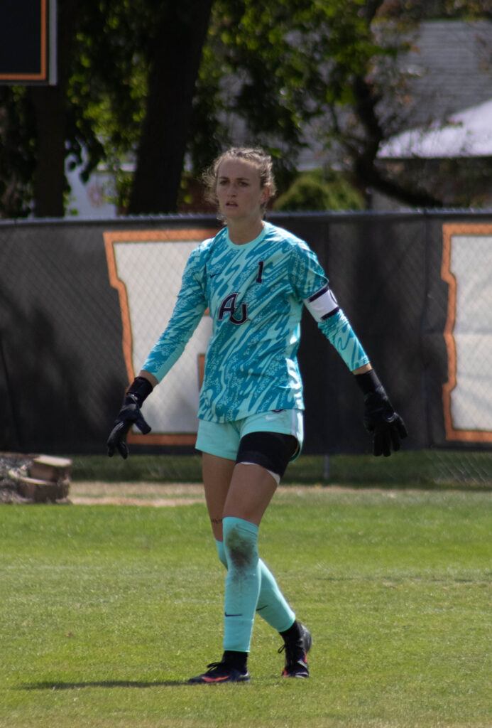 Au senior soccer player no. 1 walks on the field