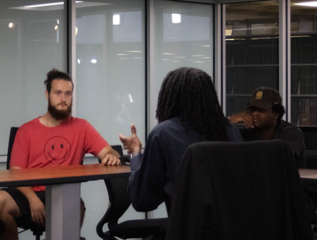 Brian 'B' Martin talking with students in IdeAU lab