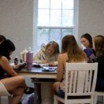 Women from the Delight Women's Bible Study sitting around a table