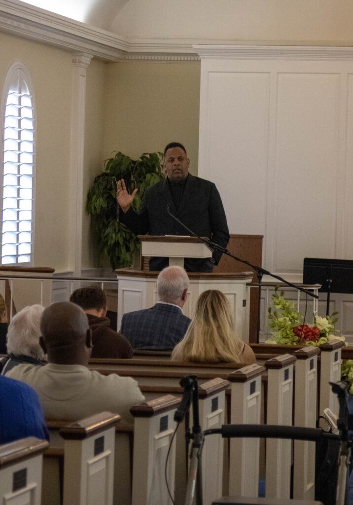 Pastor Steve Terry (New Life Church of God)at the podium speaking int the Miller Chapel service