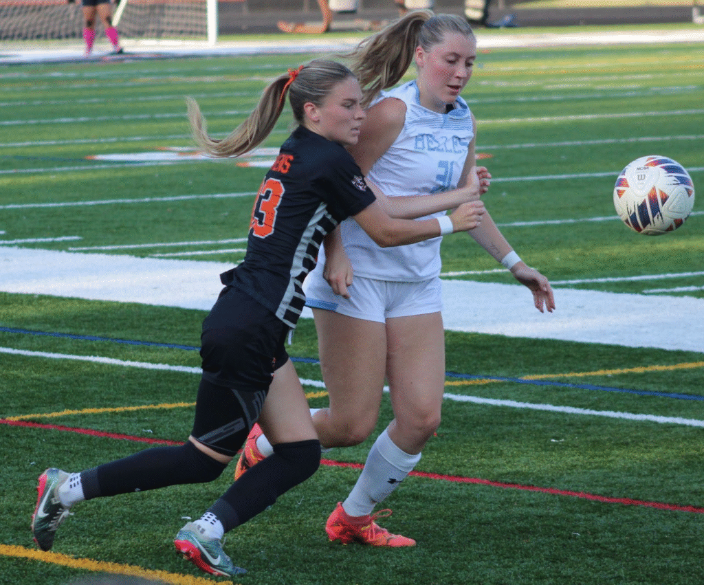 AU Kyndall Ferguson (33) and SMC Kayla O'Neal (31) chasing the ball