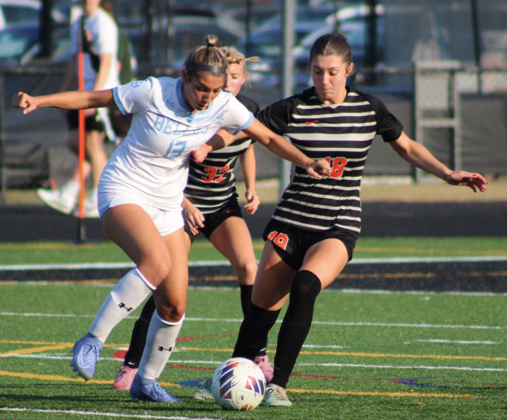 Grace Mangino (18) and Kassidy Jeffers (32) trying to take the ball from St Mary's Bella Musachio (13)
