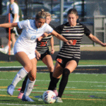 Grace Mangino (18) and Kassidy Jeffers (32) trying to take the ball from St Mary's Bella Musachio (13)