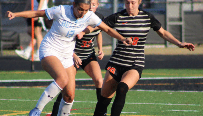 Grace Mangino (18) and Kassidy Jeffers (32) trying to take the ball from St Mary's Bella Musachio (13)
