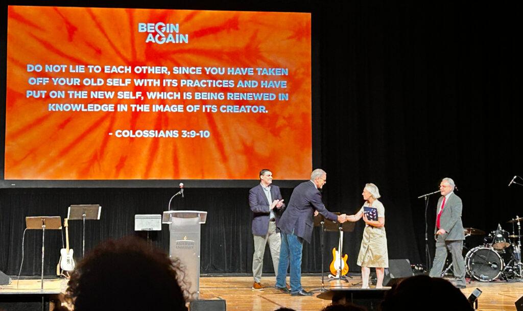Spartz and Moats shaking hands on stage