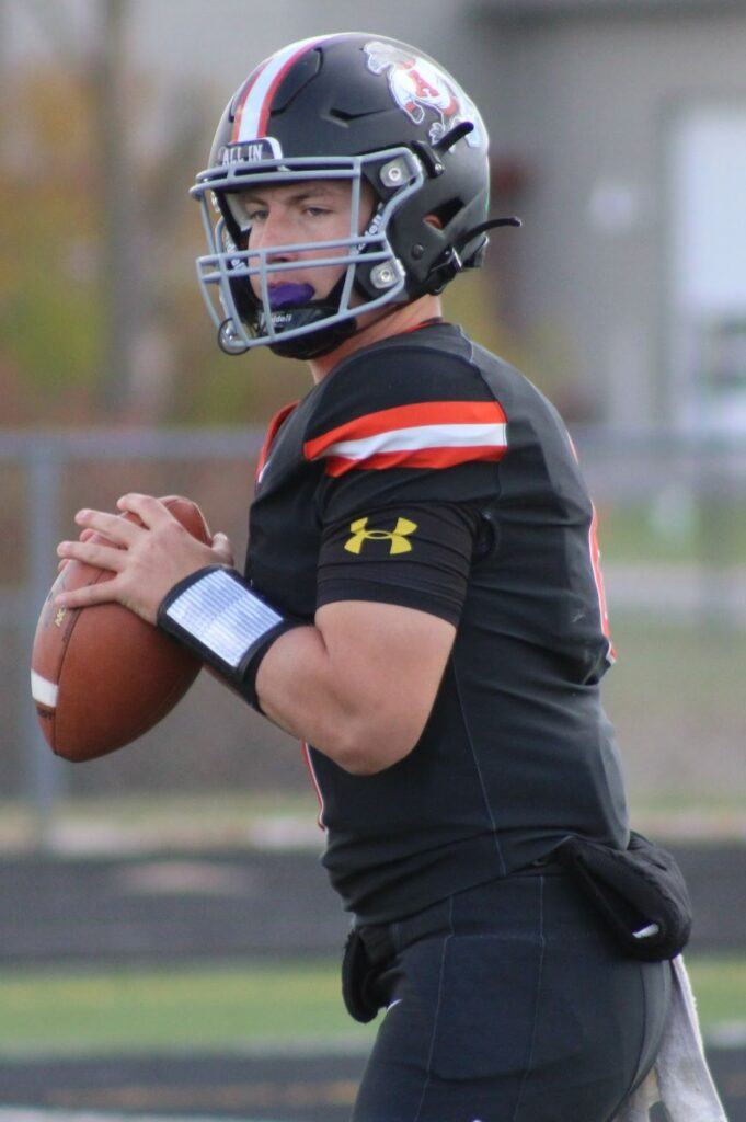 Quarterback Carson Brookbank  holding football